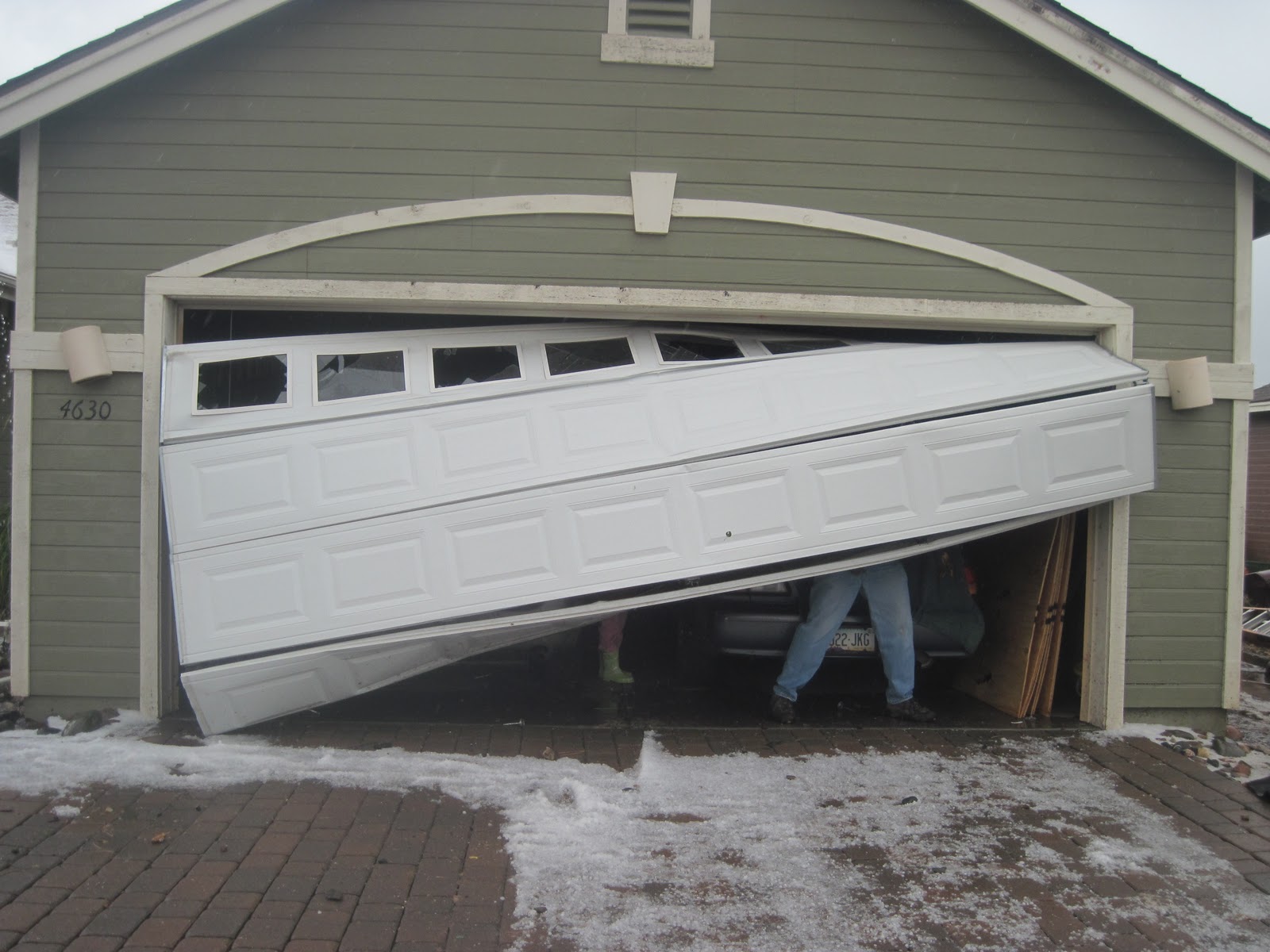 Garage door broken panel repair Michigan