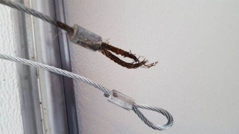 Frayed, rusty garage door lift cable